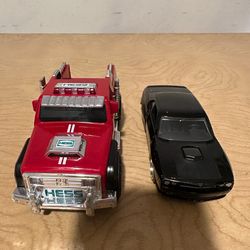 Metal black “Jada” car + Red rescue “Hess” Truck