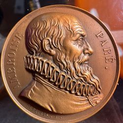 bronze commemorative medal depicting Ambroise Paré, a pioneering French surgeon known as the father of modern surgery.  