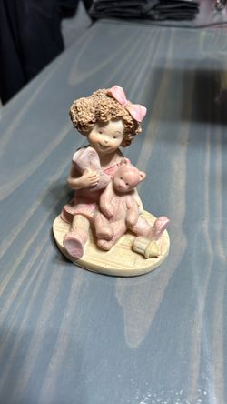 Little Girl With Bear Figuring