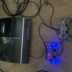 Sony Phat PlayStation 3 with 3 Controllers 4 games 2 grand theft auto games
