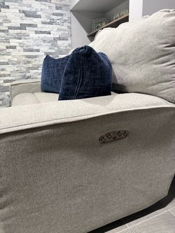 Power reclining sofa and loveseat