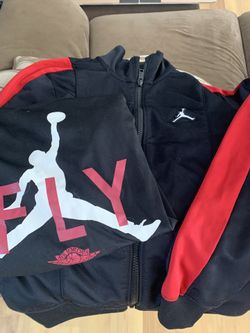 Air Jordan Zip Up , one Long Sleeve Shirt, and one Backpack.
