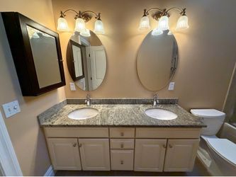 Double sink bathroom vanity - white - gray top - two oval mirrors