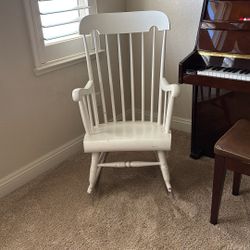 white wooden rocking chair 