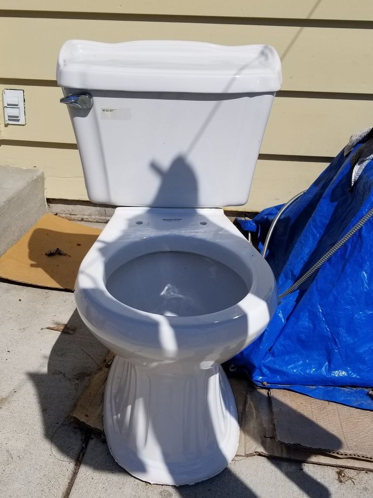 Mancesa 1 6gpf 6 0 lpf toilet is 15 inch and the back is 28 inches for
