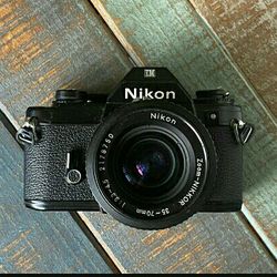 Nikon EM 35mm Film Camera And Nikkor Lens