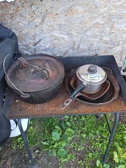 Camping stove with cast iron dishes.