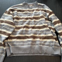 Grey and white striped sweater size medium  