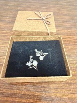 Star-shaped clip-on earrings with a pearl and rhinestone accent. Cute, stylish, and brand new.