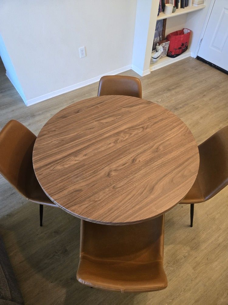 Circular Wooden Dining Table with 4 Brown Faux Leather Chairs