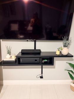 Black floating console tv
