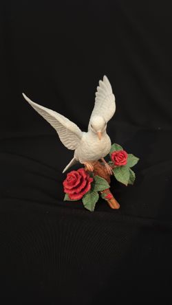 A Lenox fine porcelain Christmas Dove figurine with roses.