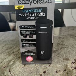 Brand New baby breeza Portable Bottle Warmer