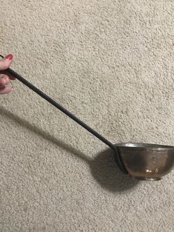 Antique bowl with long handle