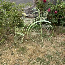 Antique green bicycle plant holder in decent shape. Holds plants in three different areas. Very unique.  Cool green color could probably use some touc