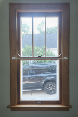 Andersen 28x60 Double-Hung Window, Vinyl w/ Mock Oak Interior, White Exterior, Mfr 2010