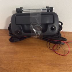 Tailgate handle with an integrated backup camera for Ford F-Series trucks