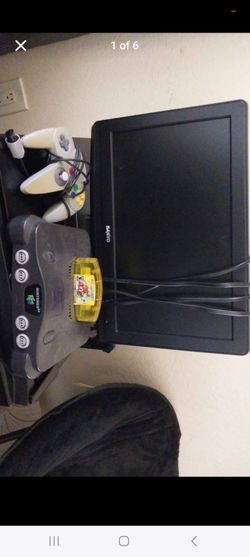 Nintendo 64 with TV and Mario game