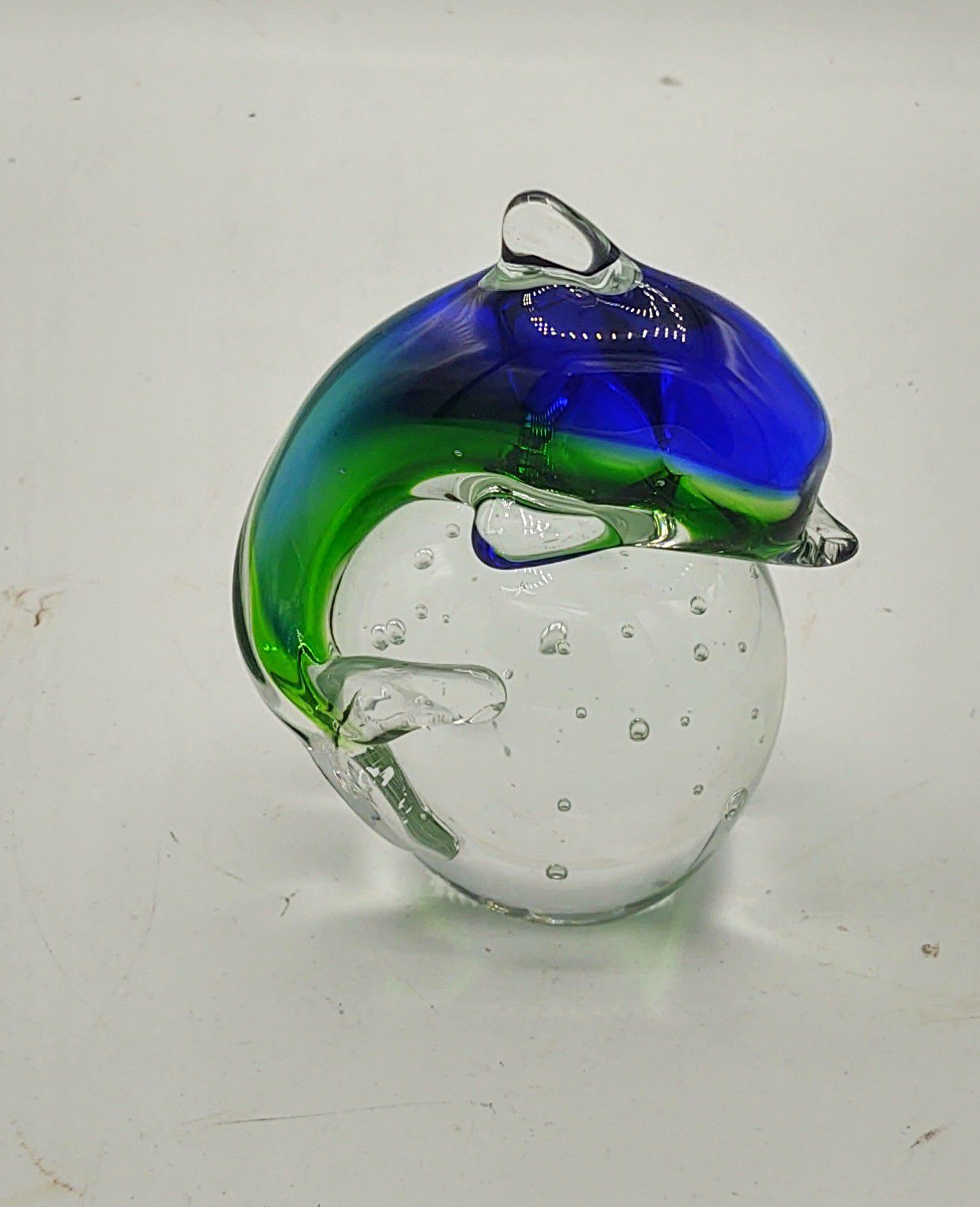 Glass dolphin paperweight