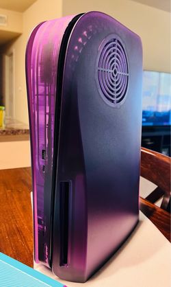 PlayStation 5 with Purple DBrand skin + original white side panels and black controller