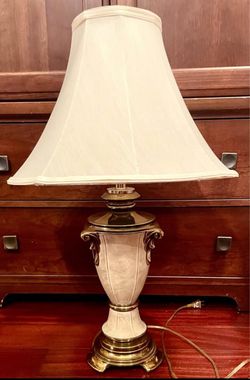 Beautiful Ivory and Gold lamp. Nice and heavy. Comes with lampshade also.
