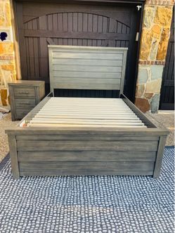 Like new Full size storage bed with night stand