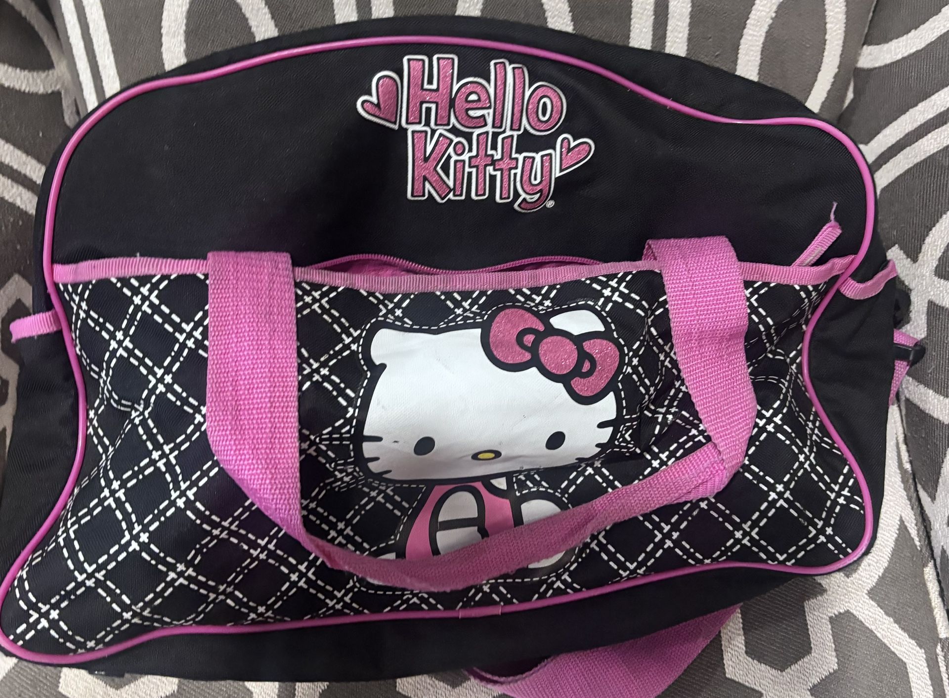 Super cute Hello Kitty duffel bag in black with pink trim and quilt pattern- Small Tear 