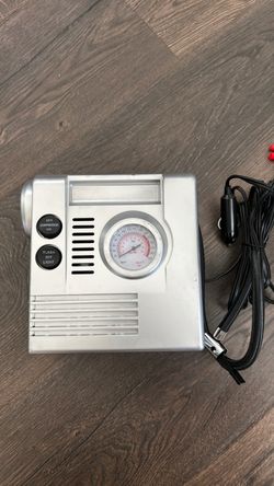 Portable air compressor with flashlight