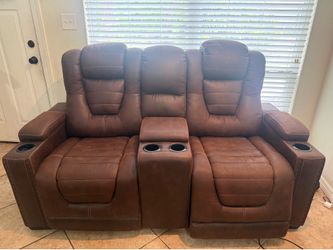 Ashley’s furniture, leather reclining console couch