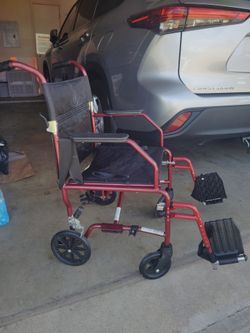 Red Transport Wheelchair with Footrests
