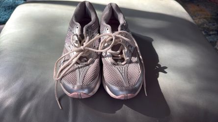 Sleek silver design with pink accents. Ideal for workouts and casual wear. Comfortable and stylish. 