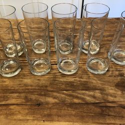 SET OF 9 GLASS TUMBLERS. EXCELLENT CONDITION. 5 1/2” TALL x 3” WIDE. $8 EACH.