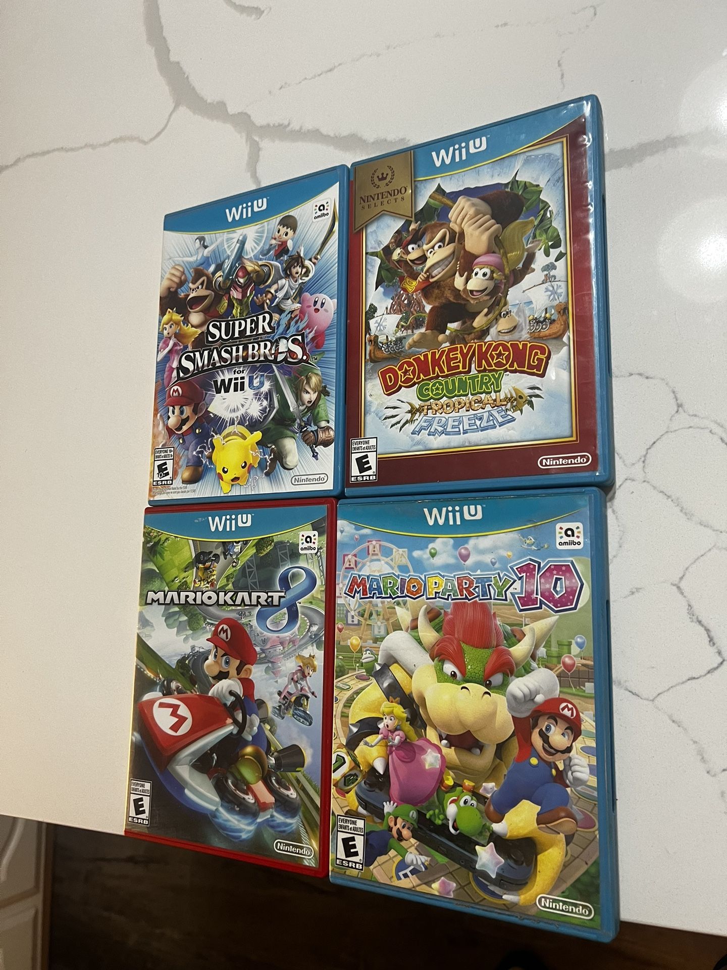 Nintendo Wii U Games Mario Kart 8, Donkey Kong Mario Party 10 & Super Smash Bros 3 of them are tested working and Mario party 10 has scratches on top 