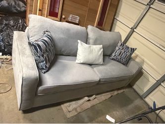 Grey Sofa with decorative pillows