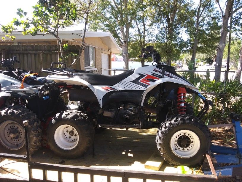 2 Atvs and trailer.polaris 2005 Traiblazer 250,polaris 1997 Trailboss