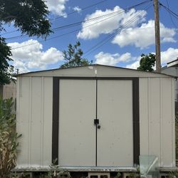 Used  Newport 10 ft. W x 8 ft. D 2-Tone Eggshell and Coffee Galvanized Metal Shed 74 sq.ft sq. ft. with Sliding Lockable Doors