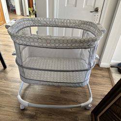 “Ingenuity Bedside Bassinet – Adjustable Height, Wheels, Great Condition”