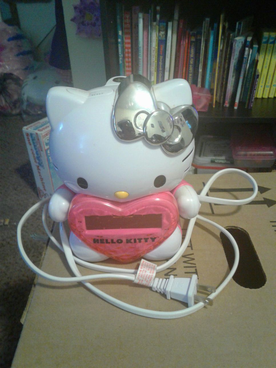 Hello Kitty alarm clock radio with ceiling projector, first aid kit, walkie talkie & earmuffs & glove set.