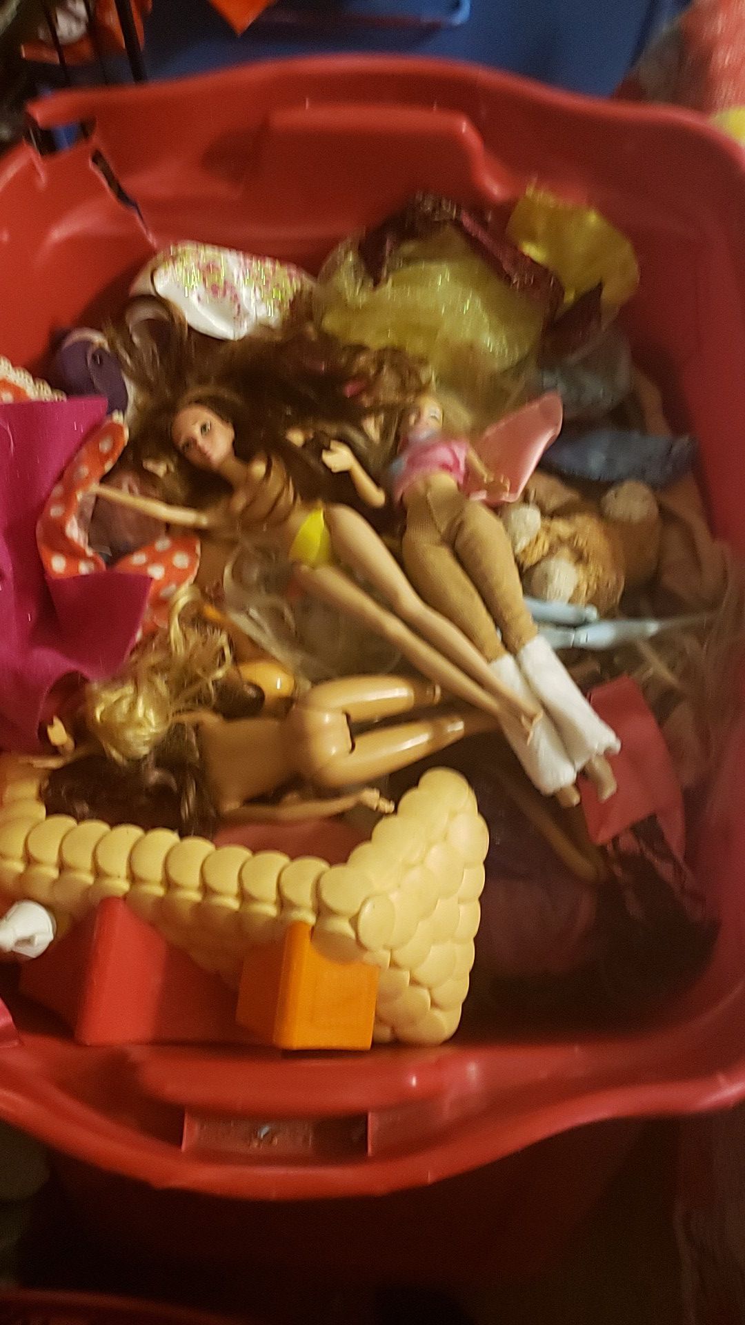 an entire tub full of Barbie's and clothes