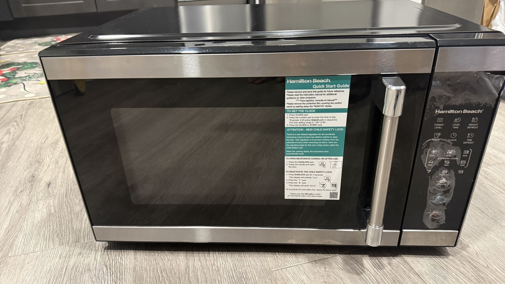 Hamilton Beach 1.1 cu ft Countertop Microwave Oven, Black and Stainless Steel