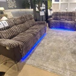 Brown 2 piece reclining sofa and loveseat set