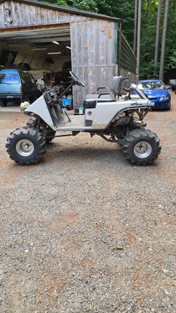 Lifted ezgo golf cart with yamaha 700cc 2 stroke engine