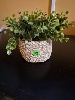 Small Artificial plant in containet