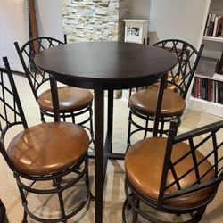 Four Countertop swivel bar stools with leather seats