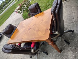 TABLE AND 4 PADDED ROLLER CHAIRS