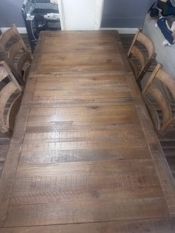 Dining room table with six chairs and two chairs