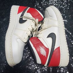 Nike Air Jordan 1 Mid sneaker in the "White Chicago". 