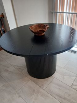Dark brown round table