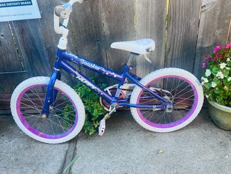 blue and pink Huffy 20" Sea Star girls' bicycle.