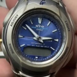 vintage Casio G-Shock MT-G 520 men's watch featuring a blue dial and a stainless steel band